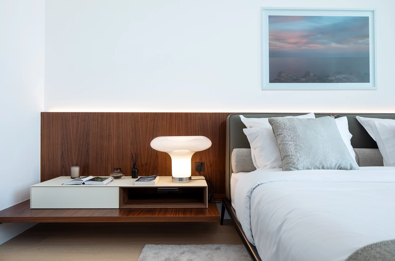 The Lana Residences Dorchester Collection by Omniyat 4 bedroom duplex bedroom detail with bedside table soft lighting and wood panel headboard in Dubai - Presented by Tohid Fetrat