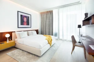 The Lana Residences Dorchester Collection by Omniyat 4 bedroom duplex bedroom with floor to ceiling windows natural light modern design and workspace area in Dubai - Presented by Tohid Fetrat