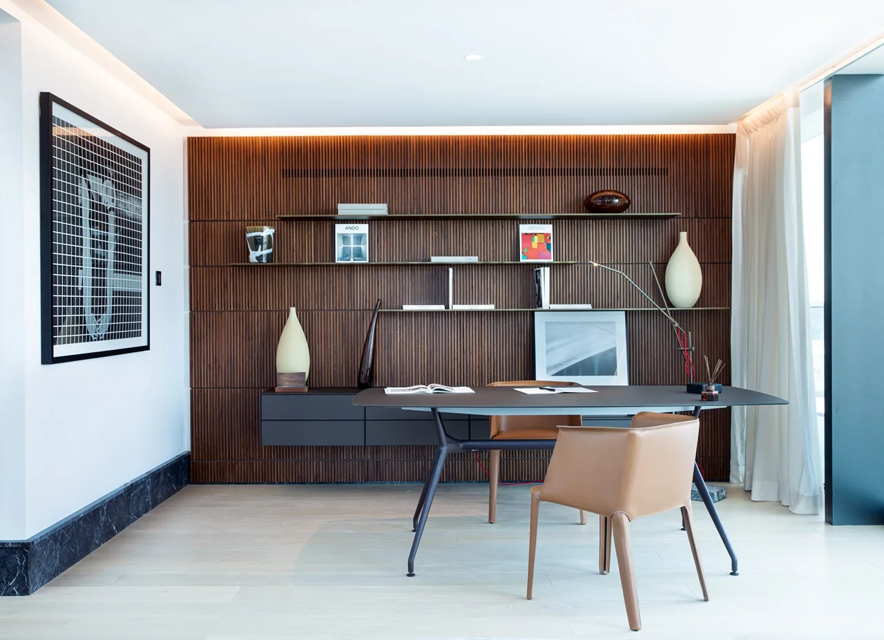 The Lana Residences Dorchester Collection by Omniyat 4 bedroom duplex home office with wood feature wall shelving and modern desk layout in Dubai - Presented by Tohid Fetrat