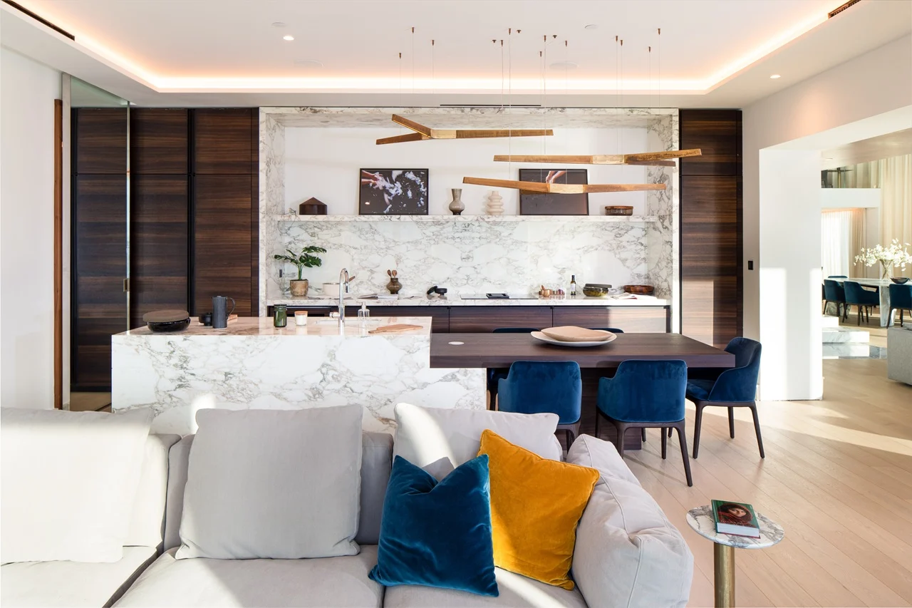 The Lana Residences Dorchester Collection by Omniyat 4 bedroom duplex marble kitchen island with open plan dining area and modern interior in Dubai - Presented by Tohid Fetrat