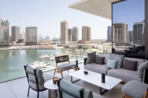 The Lana Residences Dorchester Collection by Omniyat 4 bedroom duplex with marina view balcony and luxury outdoor lounge seating in Dubai - Presented by Tohid Fetrat