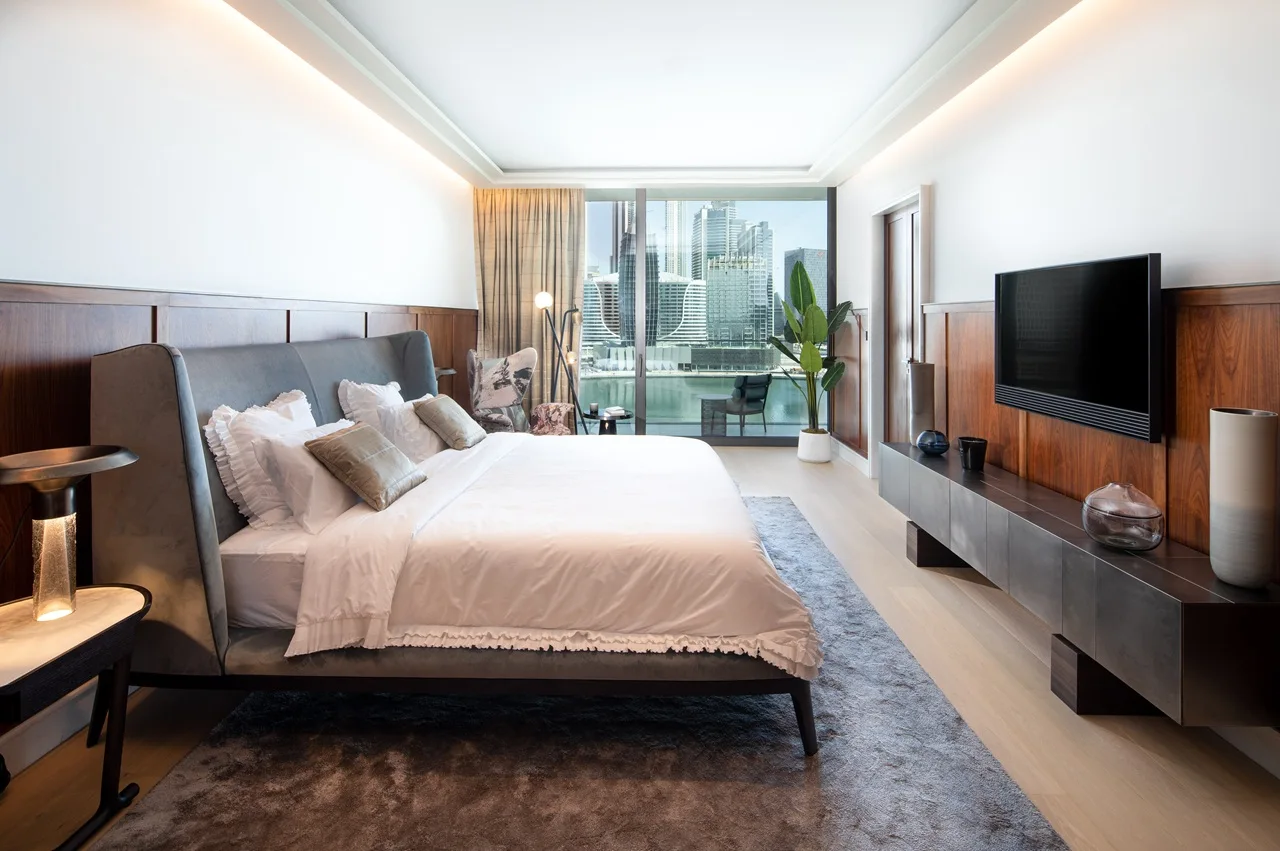 The Lana Residences Dorchester Collection by Omniyat 4 bedroom duplex master bedroom with waterfront skyline view modern interior and balcony access in Dubai - Presented by Tohid Fetrat
