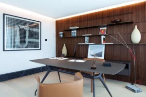 The Lana Residences Dorchester Collection by Omniyat 4 bedroom duplex private study office with wood paneling shelving and contemporary desk design in Dubai - Presented by Tohid Fetrat