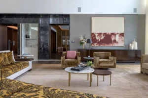 The Lana Residences Dorchester Collection by Omniyat 4 bedroom luxury living room with lounge seating marble tables and refined interior styling in Dubai - Presented by Tohid Fetrat