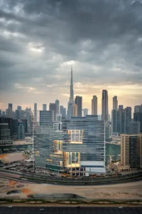 The Lana Residences Dorchester Collection by Omniyat with Downtown Dubai skyline and Burj Khalifa view under dramatic clouds in Dubai - Presented by Tohid Fetrat