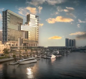 The Lana Residences Dorchester Collection by Omniyat waterfront towers reflecting sunlight with marina and yachts in Dubai - Presented by Tohid Fetrat