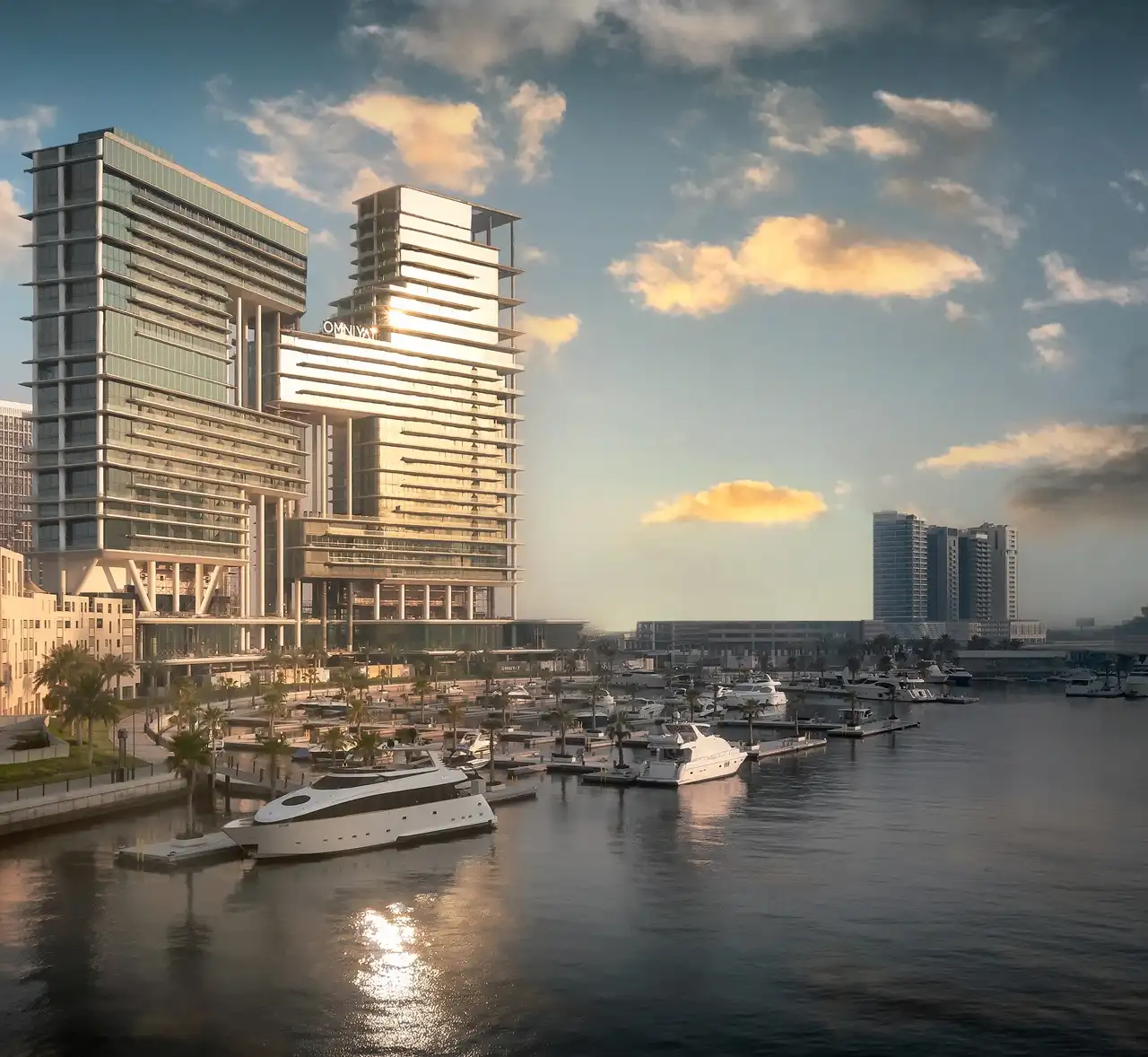 The Lana Residences Dorchester Collection by Omniyat waterfront towers reflecting sunlight with marina and yachts in Dubai - Presented by Tohid Fetrat