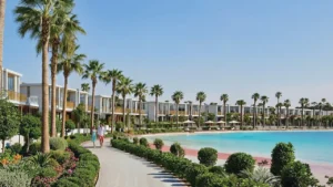 Tilal Binghatti Phase 1 by Binghatti waterfront villas with palm lined walkway and landscaped lagoon edge in Dubai - Presented by Tohid Fetrat