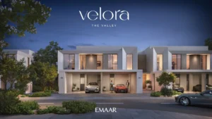 Velora The Valley by Emaar townhouse night front exterior with illuminated façade and covered parking in Dubai - Presented by Tohid Fetrat