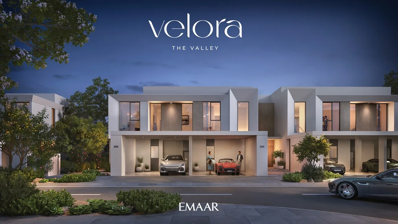 Velora The Valley by Emaar townhouse night front exterior with illuminated façade and covered parking in Dubai - Presented by Tohid Fetrat