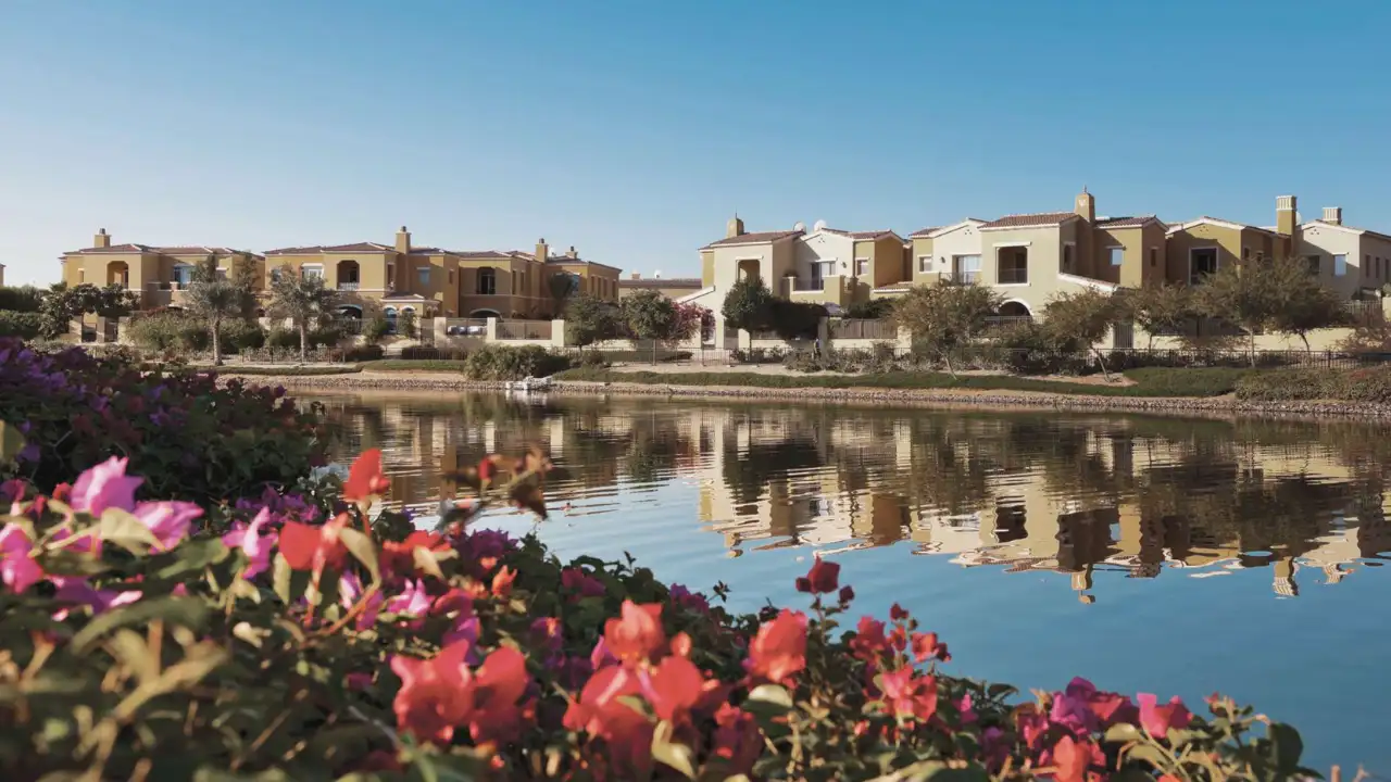 Arabian Ranches by Emaar villas overlooking lake with landscaped gardens and waterfront community view in Dubai Presented by Tohid Fetrat