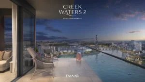 Creek Waters 2 at Dubai Creek Harbour by Emaar apartment balcony seating with night waterfront skyline view in Dubai - Presented by Tohid Fetrat