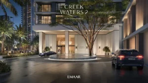 Creek Waters 2 at Dubai Creek Harbour by Emaar main entrance with landscaped driveway and illuminated lobby exterior in Dubai - Presented by Tohid Fetrat