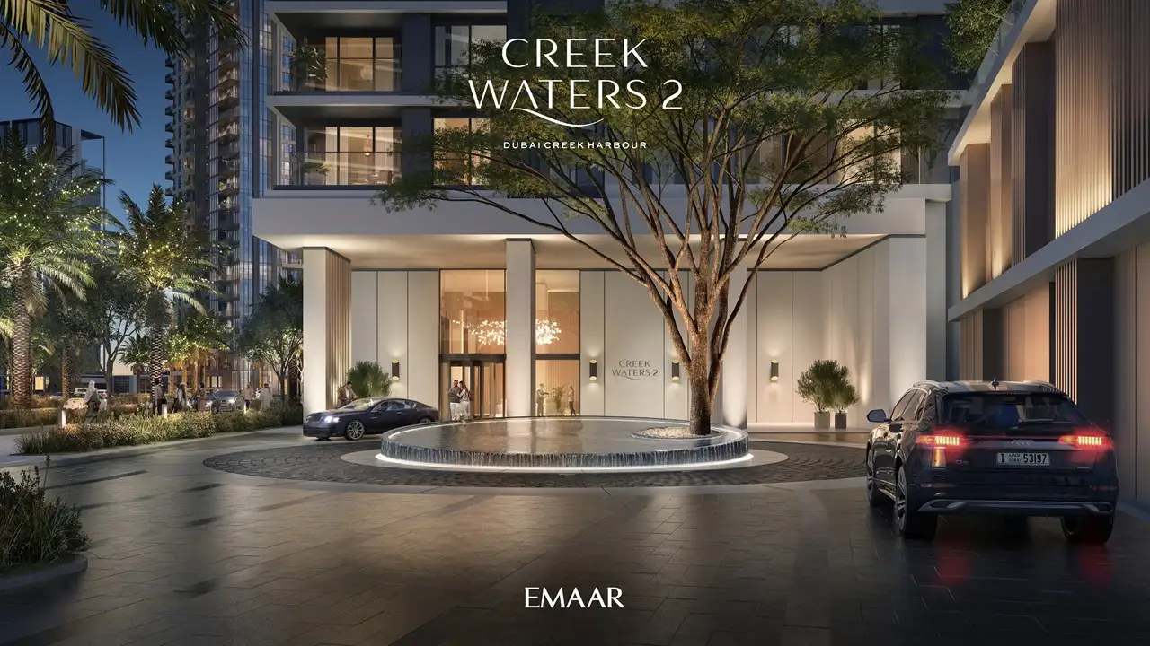 Creek Waters 2 at Dubai Creek Harbour by Emaar main entrance with landscaped driveway and illuminated lobby exterior in Dubai - Presented by Tohid Fetrat