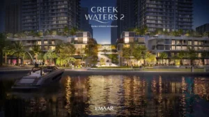Creek Waters 2 at Dubai Creek Harbour by Emaar waterfront promenade with marina view and illuminated buildings at night in Dubai - Presented by Tohid Fetrat