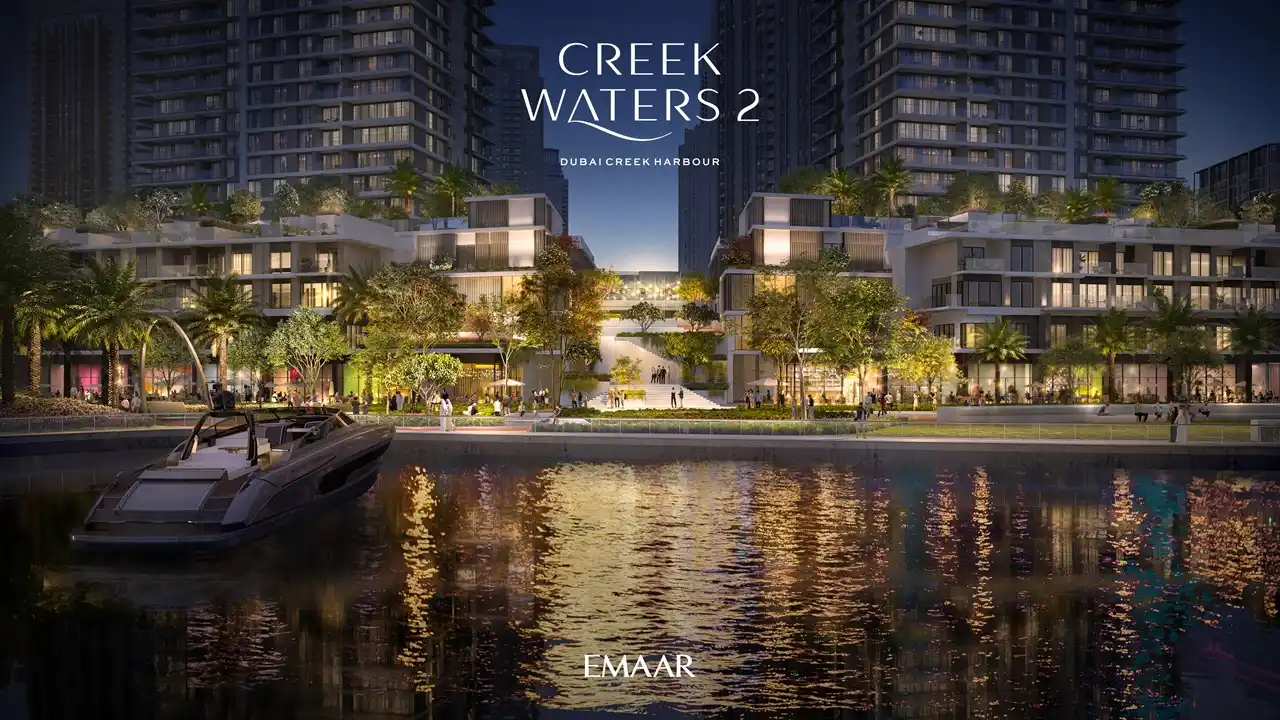 Creek Waters 2 at Dubai Creek Harbour by Emaar waterfront promenade with marina view and illuminated buildings at night in Dubai - Presented by Tohid Fetrat