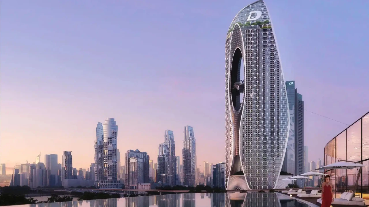 DAMAC developer iconic modern tower with unique architectural design and Dubai skyline at sunset Presented by Tohid Fetrat