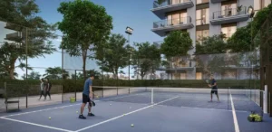 Golf Verge at Emaar South by Emaar outdoor tennis court surrounded by landscaped greenery and residential towers in Dubai - Presented by Tohid Fetrat