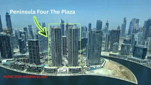 Peninsula Four The Plaza construction update April 2026 showing twin residential towers beside Dubai Water Canal captured by Tohid Fetrat