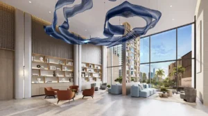 Peninsula Four The Plaza by Select Group luxury lobby interior with double height ceilings and modern lounge seating in Dubai Presented by Tohid Fetrat