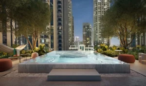 Rove Home Downtown Dubai by IRTH Development relaxation pool with landscaped surroundings and city views in Dubai Presented by Tohid Fetrat