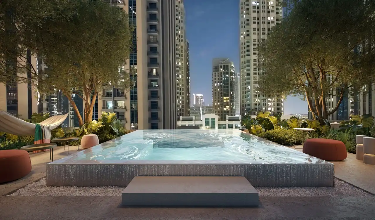 Rove Home Downtown Dubai by IRTH Development relaxation pool with landscaped surroundings and city views in Dubai Presented by Tohid Fetrat