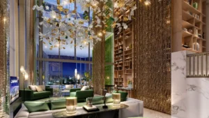 Safa One by DAMAC in Safa Park luxury lounge interior with double height ceilings and designer chandelier in Dubai - Presented by Tohid Fetrat