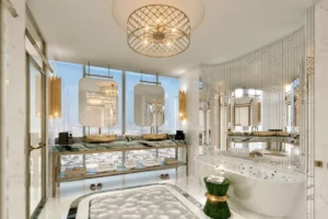 Safa One by DAMAC in Safa Park luxury spa style bathroom with panoramic city views and gold accents in Dubai - Presented by Tohid Fetrat