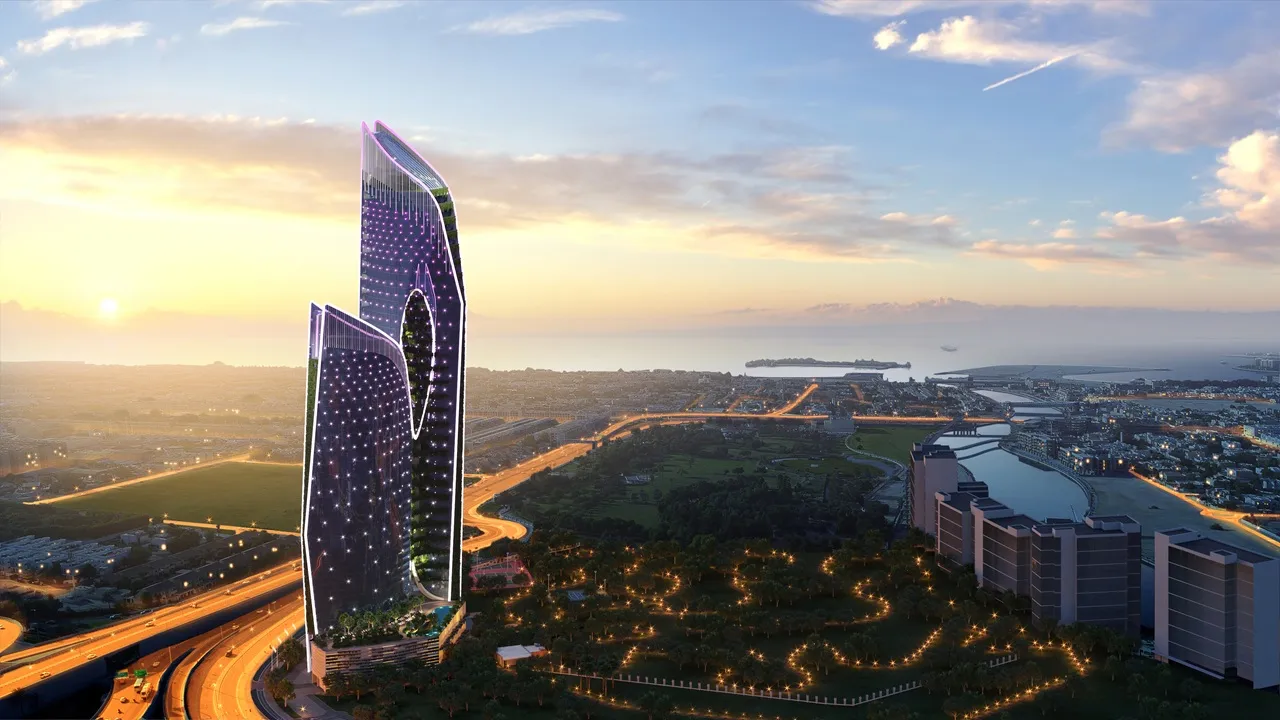 Safa One by DAMAC in Safa Park illuminated aerial sunset view overlooking Dubai skyline and Gulf coastline - Presented by Tohid Fetrat