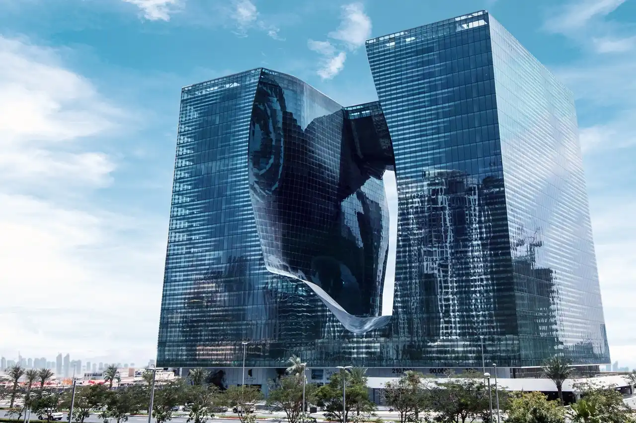 The Opus Penthouse by OMNIYAT iconic architectural exterior with sculptural glass façade and contemporary design in Dubai - Presented by Tohid Fetrat