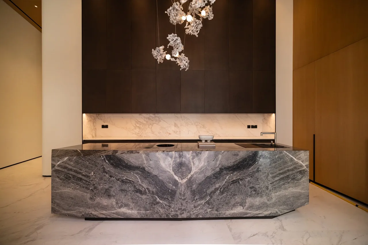 The Opus Penthouse by OMNIYAT designer kitchen with marble island, luxury finishes, and contemporary architectural detailing in Dubai - Presented by Tohid Fetrat