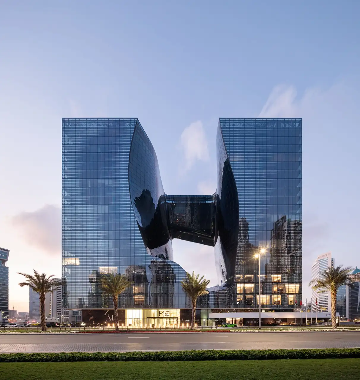 The Opus Penthouse by OMNIYAT iconic exterior architecture with sculptural glass façade and landmark contemporary design in Dubai - Presented by Tohid Fetrat