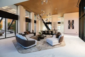 The Opus Penthouse by OMNIYAT open plan living space with double height ceilings, designer furnishings, and contemporary luxury interiors in Dubai - Presented by Tohid Fetrat
