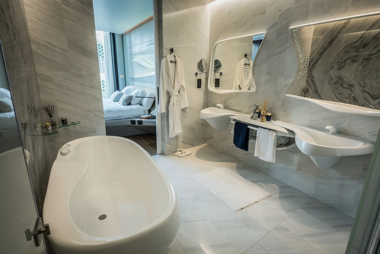 The Opus Residences by OMNIYAT luxury marble bathroom interior with freestanding bathtub in Dubai - Presented by Tohid Fetrat