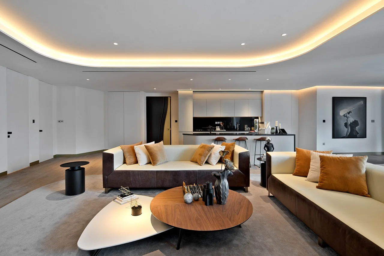 The Opus Residences by OMNIYAT luxury 2 bedroom living room interior with open kitchen in Dubai - Presented by Tohid Fetrat
