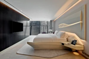 The Opus Residences by OMNIYAT luxury 2 bedroom master bedroom interior with skyline views in Dubai - Presented by Tohid Fetrat