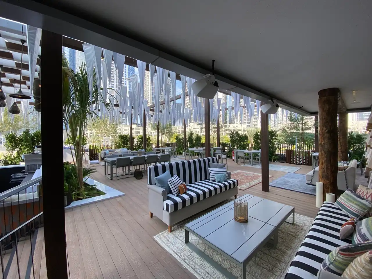 The Opus Residences by OMNIYAT Deseo Rooftop Lounge terrace seating area in Dubai - Presented by Tohid Fetrat