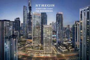 The St. Regis Residences Downtown Dubai by Emaar illuminated residential towers within the Downtown Dubai skyline at night in Dubai - Presented by Tohid Fetrat