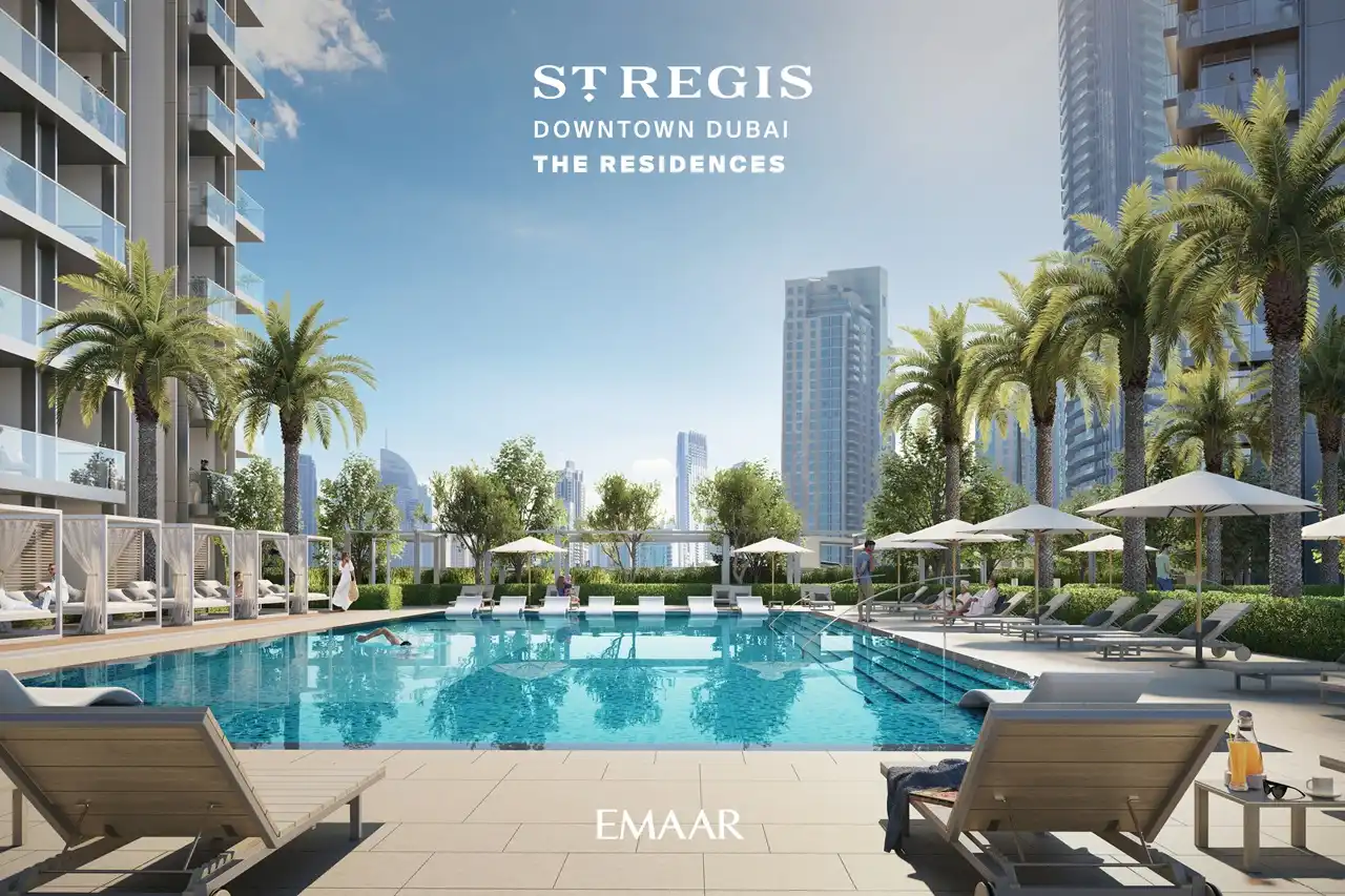 The St. Regis Residences Downtown Dubai by Emaar resort style swimming pool surrounded by palm trees and sun loungers in Dubai - Presented by Tohid Fetrat