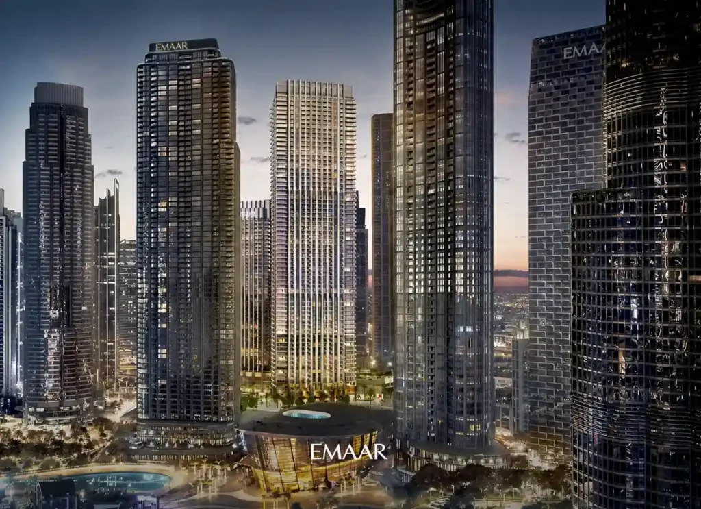 The St. Regis Residences Downtown Dubai by Emaar illuminated residential tower surrounded by luxury skyscrapers in the Downtown Dubai skyline at dusk in Dubai - Presented by Tohid Fetrat