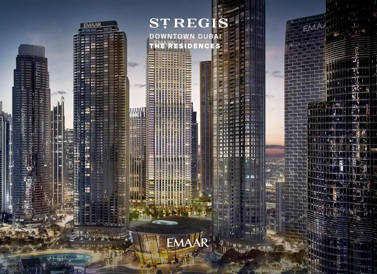 The St. Regis Residences Downtown Dubai by Emaar illuminated residential tower surrounded by Downtown Dubai skyscrapers at dusk in Dubai - Presented by Tohid Fetrat