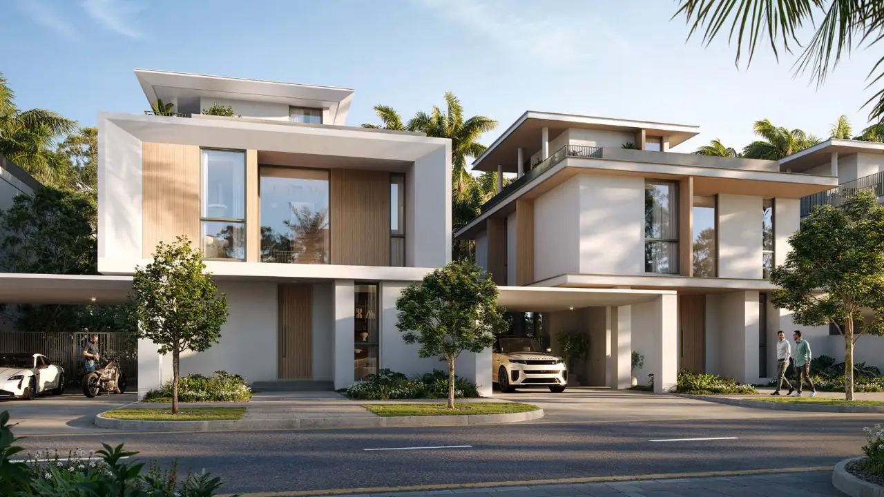 Modern townhouses and villas with contemporary architecture landscaped surroundings and private parking along a residential street at The Valley Dubai Presented by Tohid Fetrat