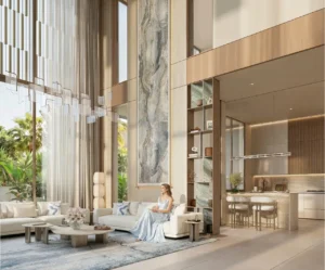 Tilal Binghatti Mansion double-height living room with luxury lounge seating, designer chandelier, and open kitchen space in Dubai - Presented by Tohid Fetrat