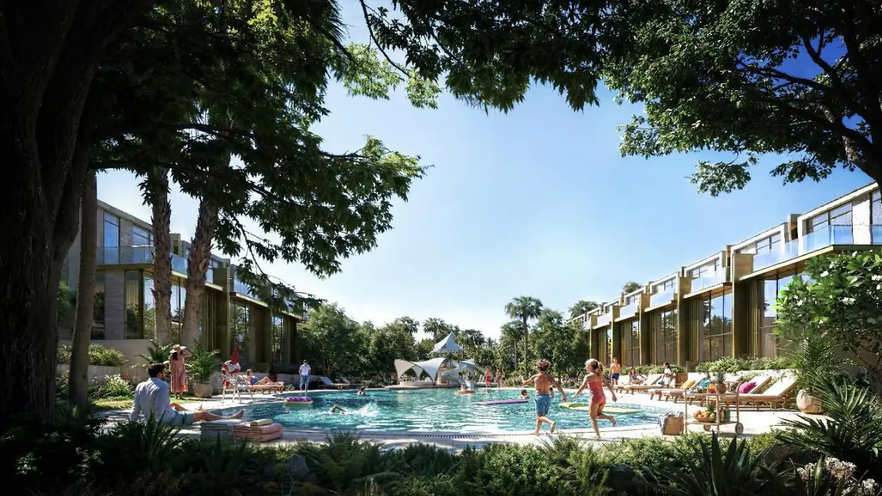 Tilal Binghatti Phase 1 by Binghatti community pool with families relaxing swimming and modern villas surrounded by greenery in Dubai - Presented by Tohid Fetrat
