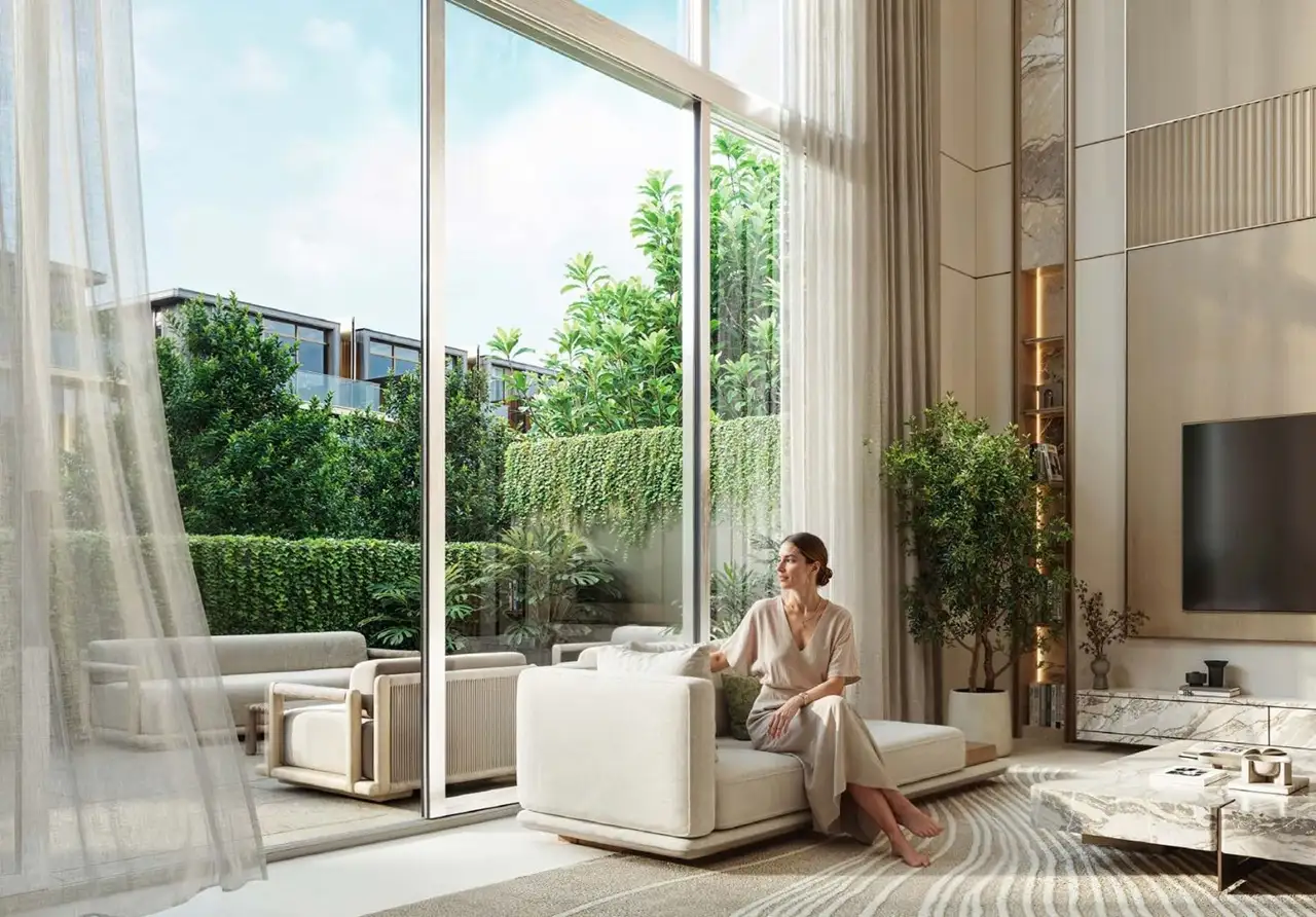 Tilal Binghatti Villas & Mansions by Binghatti luxury living room with floor to ceiling windows and garden views in Dubai - Presented by Tohid Fetrat