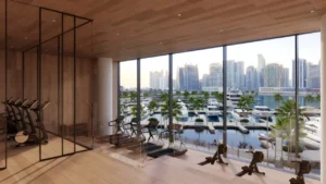 VELA Dorchester Collection by Omniyat fitness center with marina views and floor to ceiling windows in Dubai - Presented by Tohid Fetrat