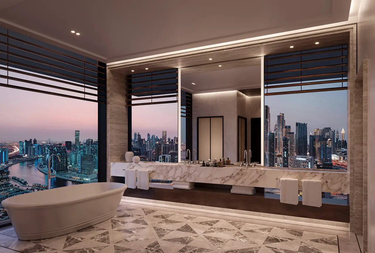 VELA Dorchester Collection by Omniyat luxury bathroom with Dubai Water Canal skyline views and marble interiors in Dubai - Presented by Tohid Fetrat