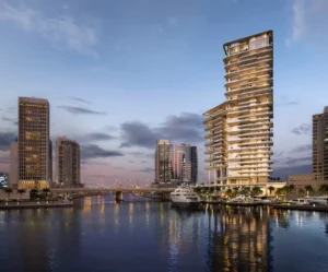 VELA Dorchester Collection by Omniyat waterfront residential tower overlooking Dubai Water Canal at sunset in Dubai - Presented by Tohid Fetrat