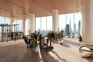 VELA Viento Dorchester Collection by Omniyat luxury fitness center with Burj Khalifa skyline view in Dubai - Presented by Tohid Fetrat