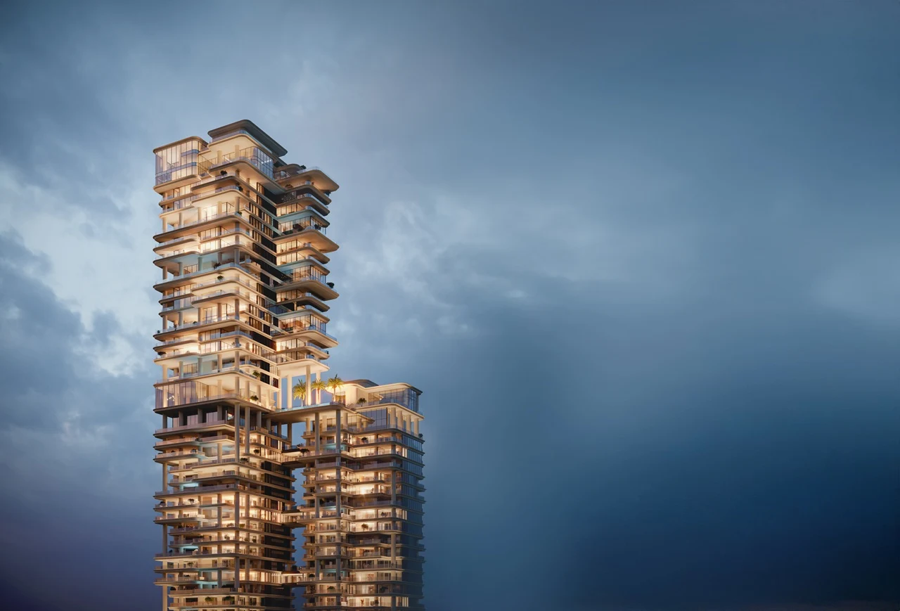 VELA Viento Dorchester Collection by Omniyat illuminated luxury tower architecture at dusk in Dubai - Presented by Tohid Fetrat